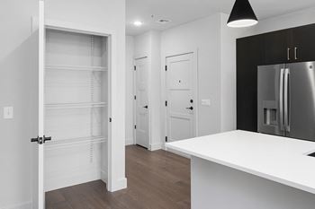 A kitchen in a bedroom plus den unit at the casey, 2100 delgany,